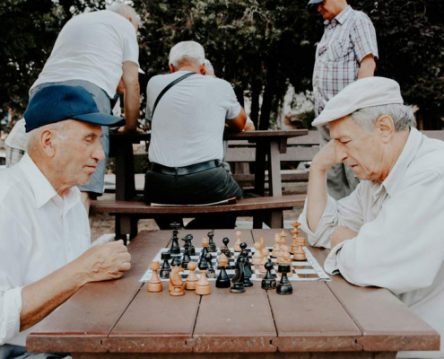 retired men playing chess in their golden years