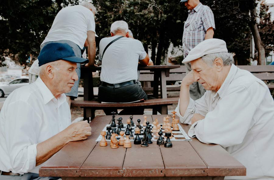 retired men playing chess in their golden years